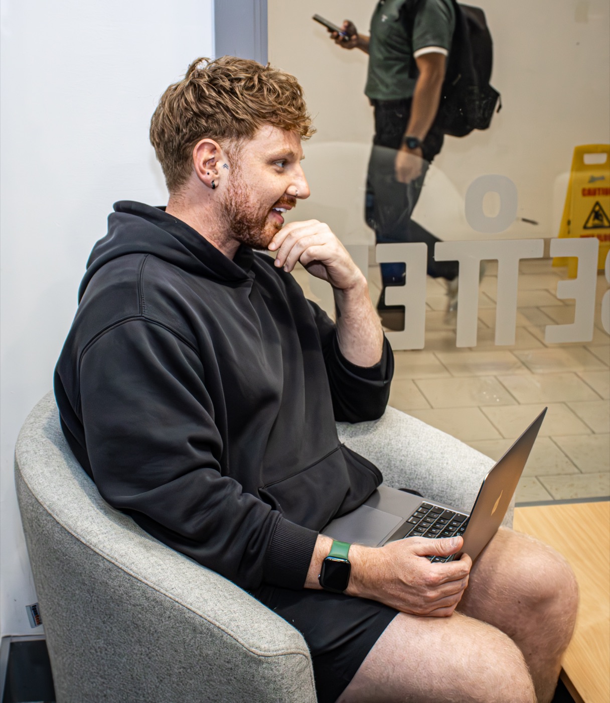 Andy Kirkpatrick working on a laptop
